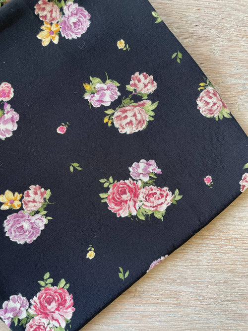 Close-up of the Pink print crepe showing the chalky, softly drawn roses and the fine grain of the Moroccan crepe weave | Atelier 27