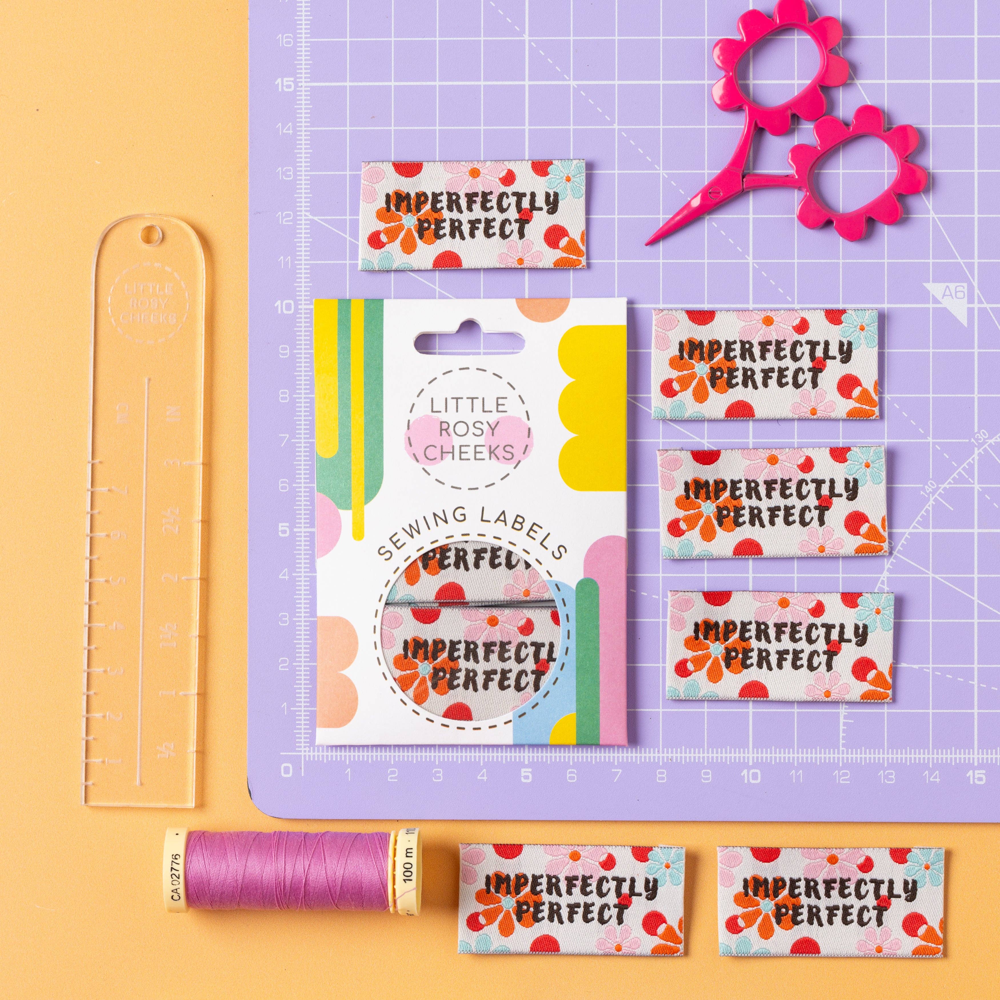 Imperfectly Perfect label shown on cutting mat for size reference
