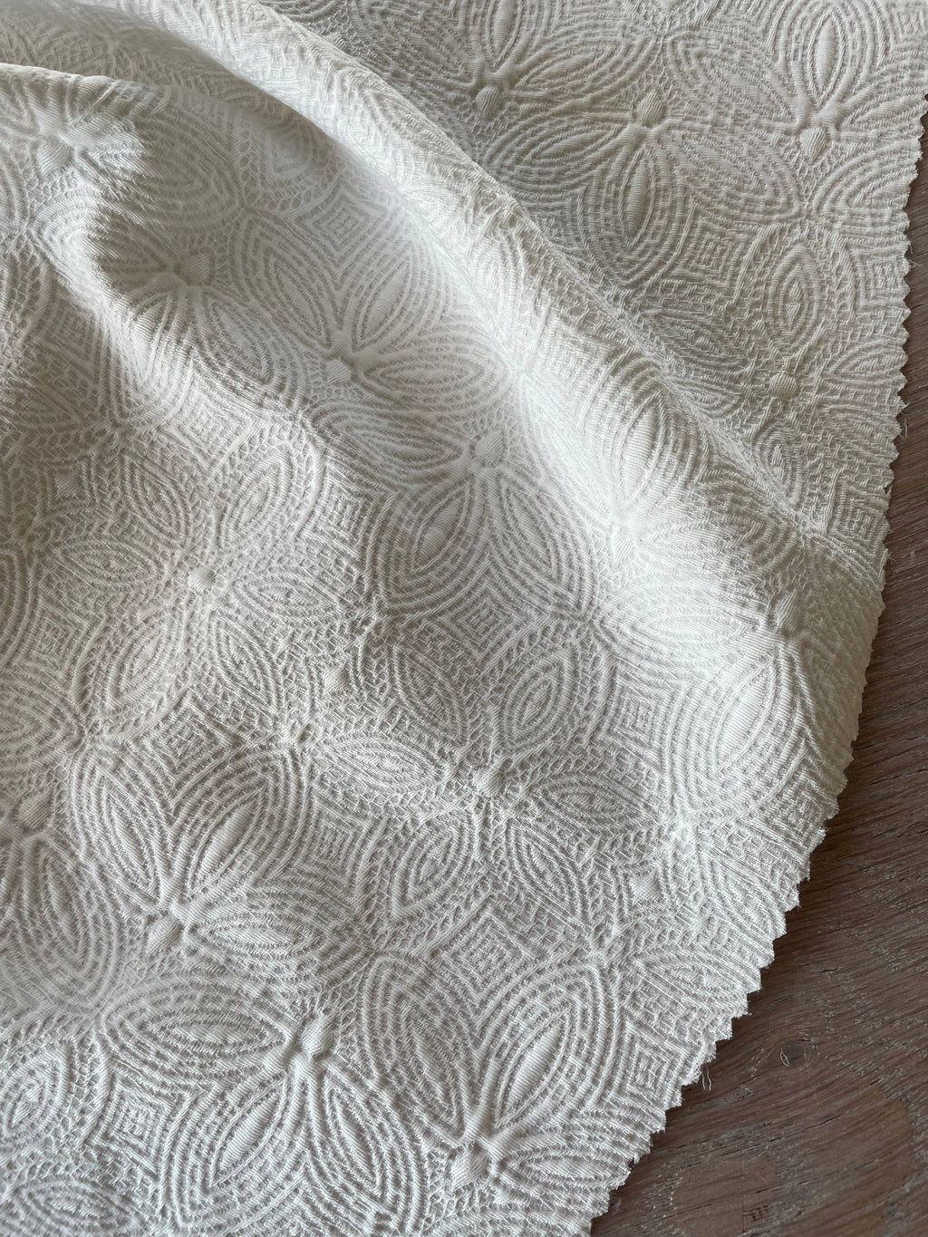 Close-up of Poem jacquard fabric by Atelier 27 showing delicate ivory woven floral texture