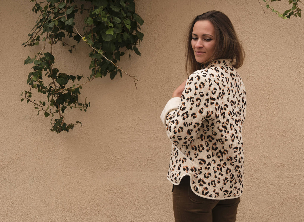Side view of the leopard quilted Siloé Jacket showing turned-back contrast cuffs