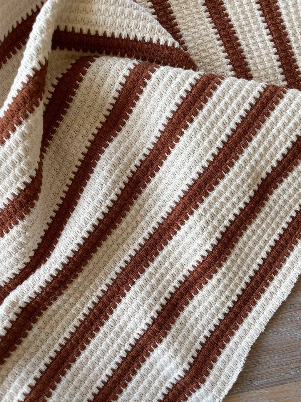 Close-up of Pepita textured knit fabric by Atelier 27 showing stripe and knit texture