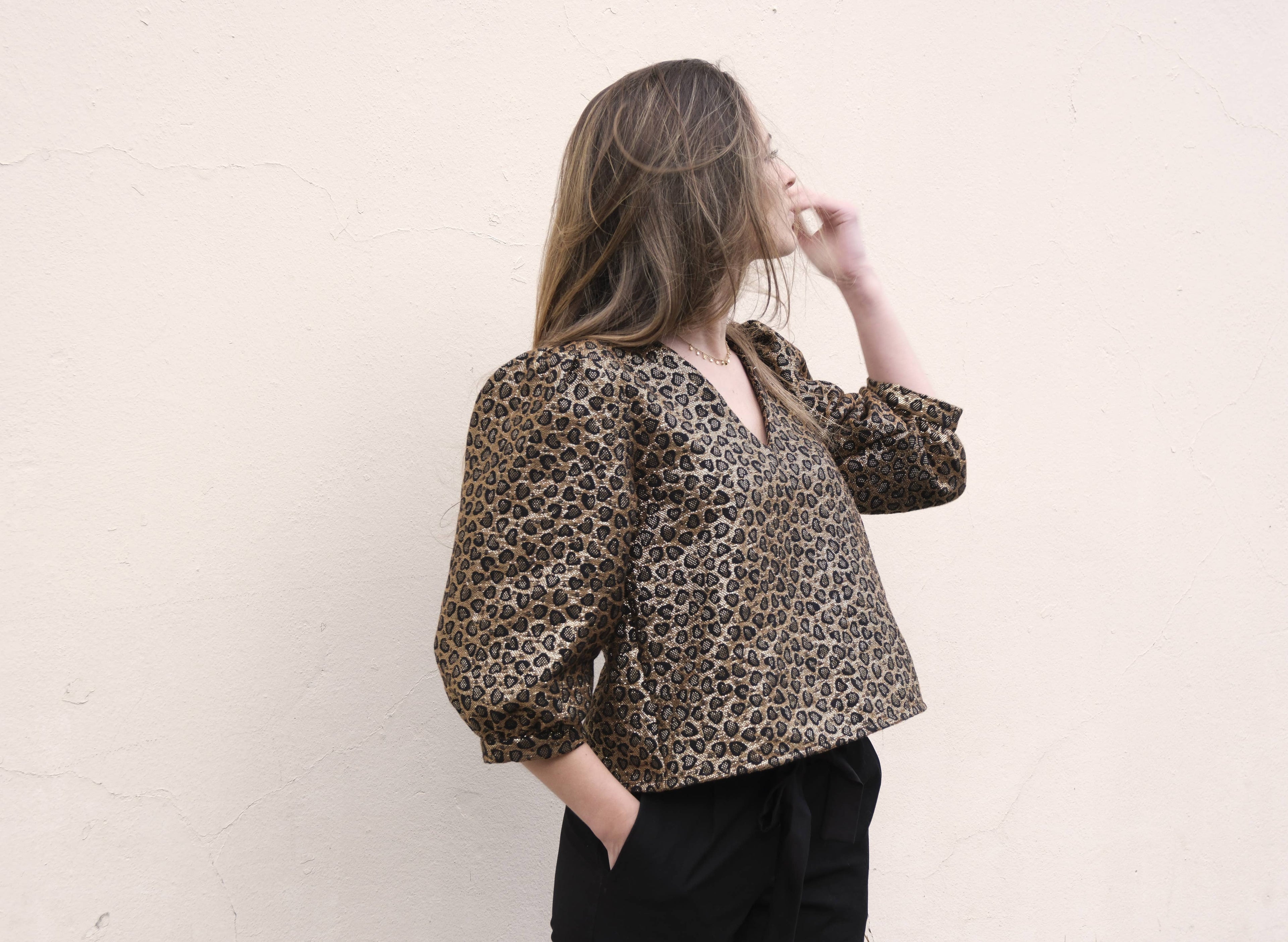 Eléanor Top sewn in olive leopard jacquard, worn with black trousers, front view