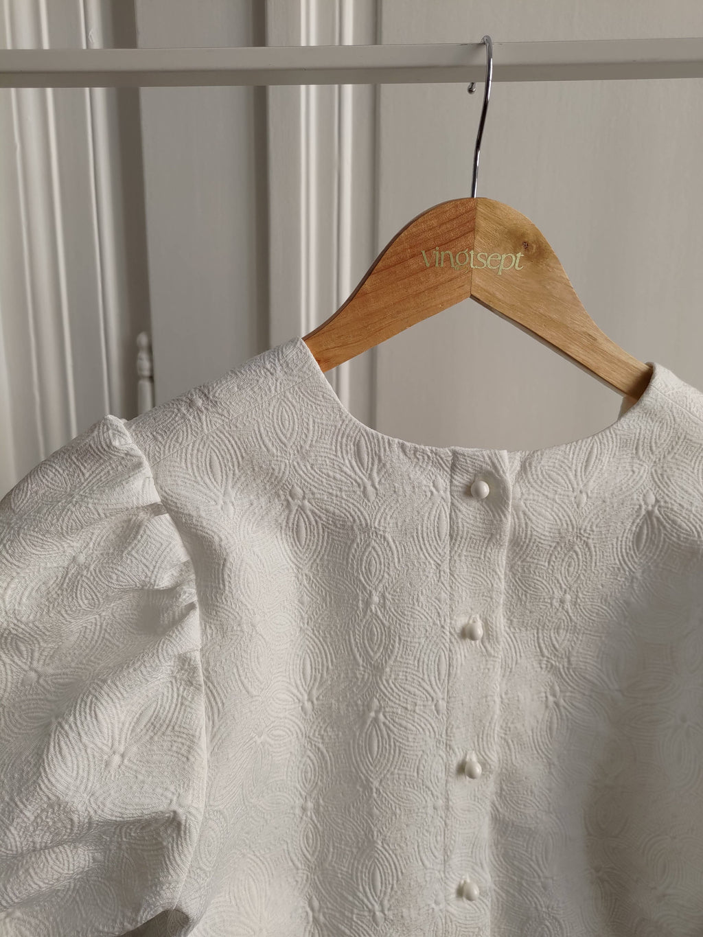 Atelier 27 Poem print jacquard fabric swatch showing ivory ground and woven motif
