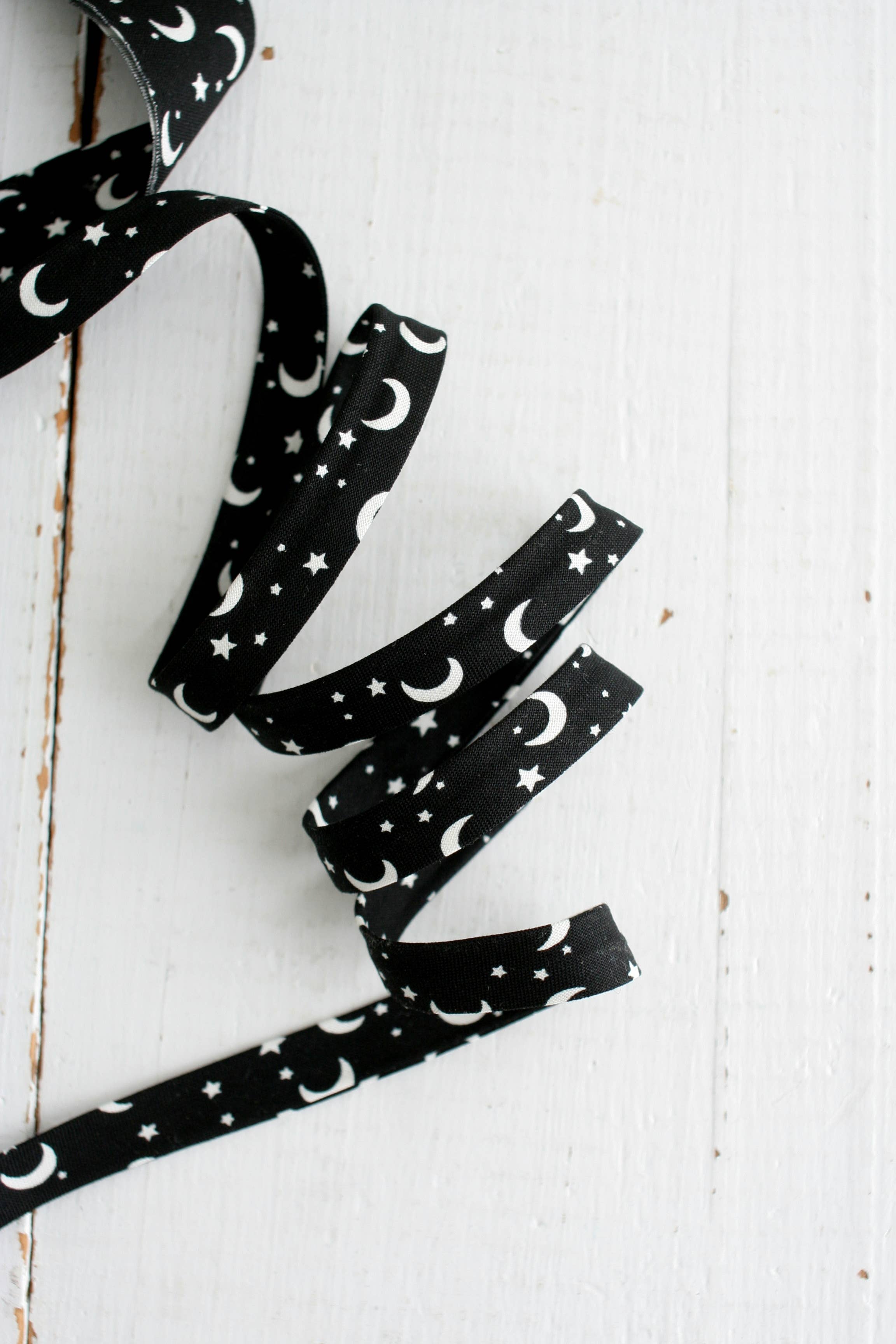 Moon and Stars Glow in the Dark 1/2 inch double fold cotton bias binding tape by Bessie Pearl Binding Co