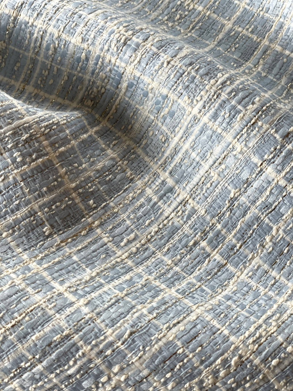 Close-up of Augustin jacquard fabric by Atelier 27 showing woven metallic thread detail