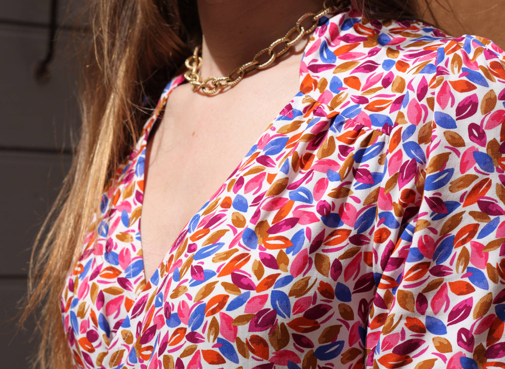 Close-up of the Garance Dress gathered shoulder yoke and neckline in multicolour print