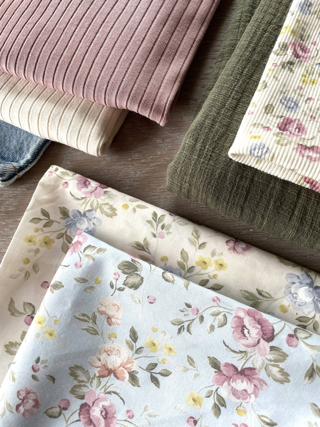 Close-up of Louison mini-rib jersey by Atelier 27 showing floral stripe and rib texture