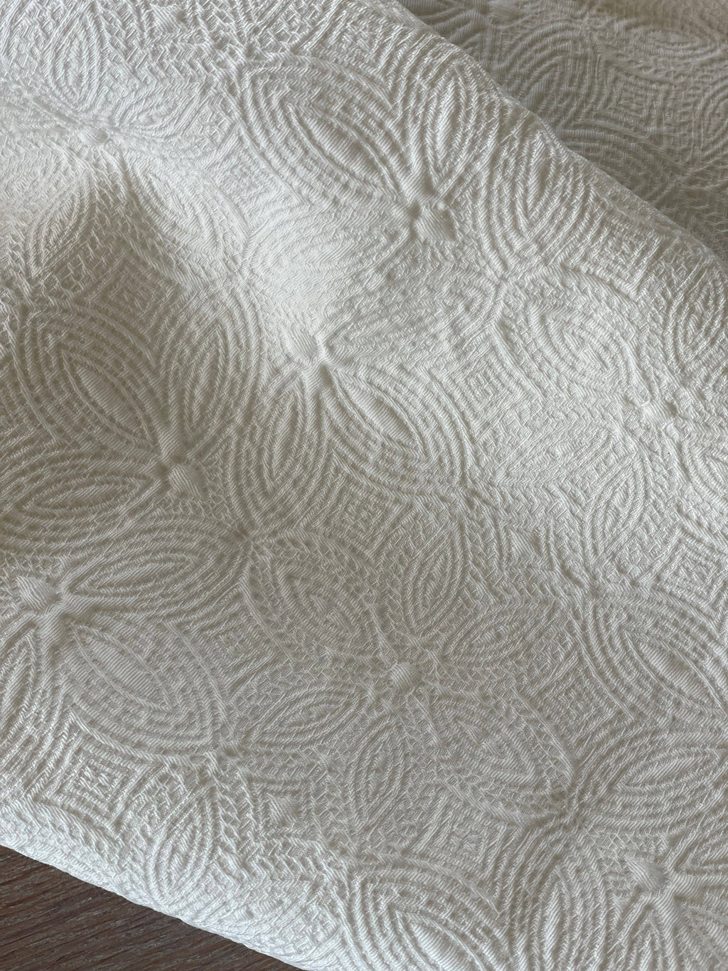 Atelier 27 Poem ivory jacquard fabric showing weight and drape on dress form