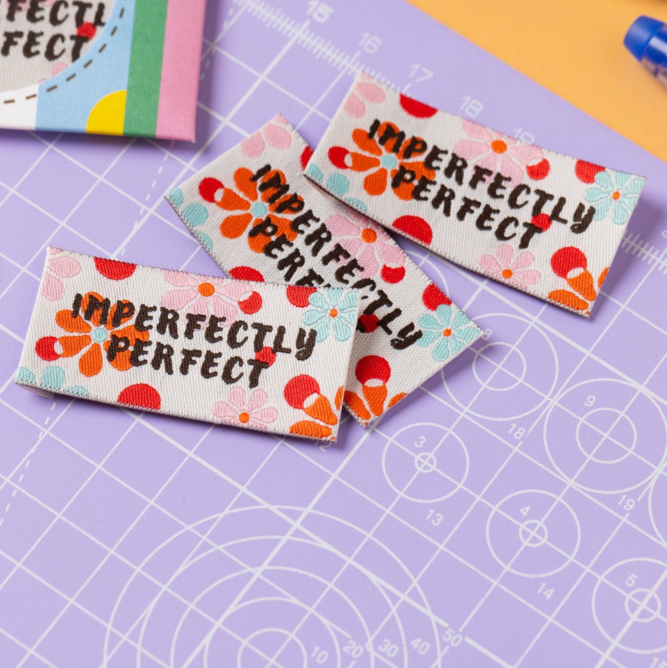 Imperfectly Perfect woven sewing label pack styled flat lay