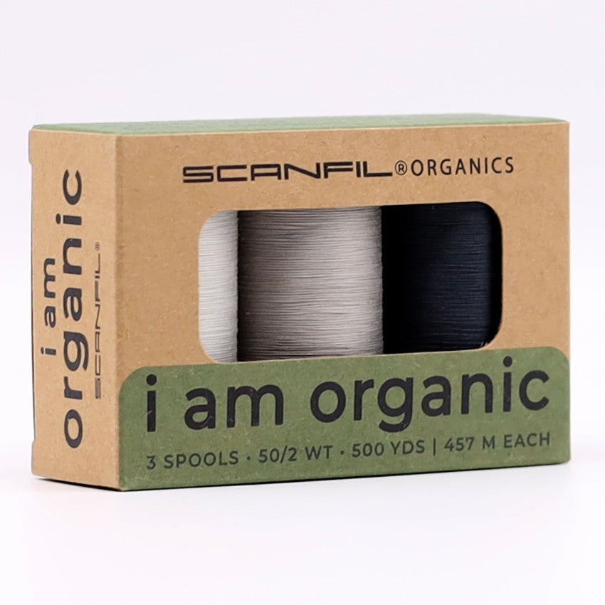 Stormy Greys organic cotton thread spools on wooden spools, detail view