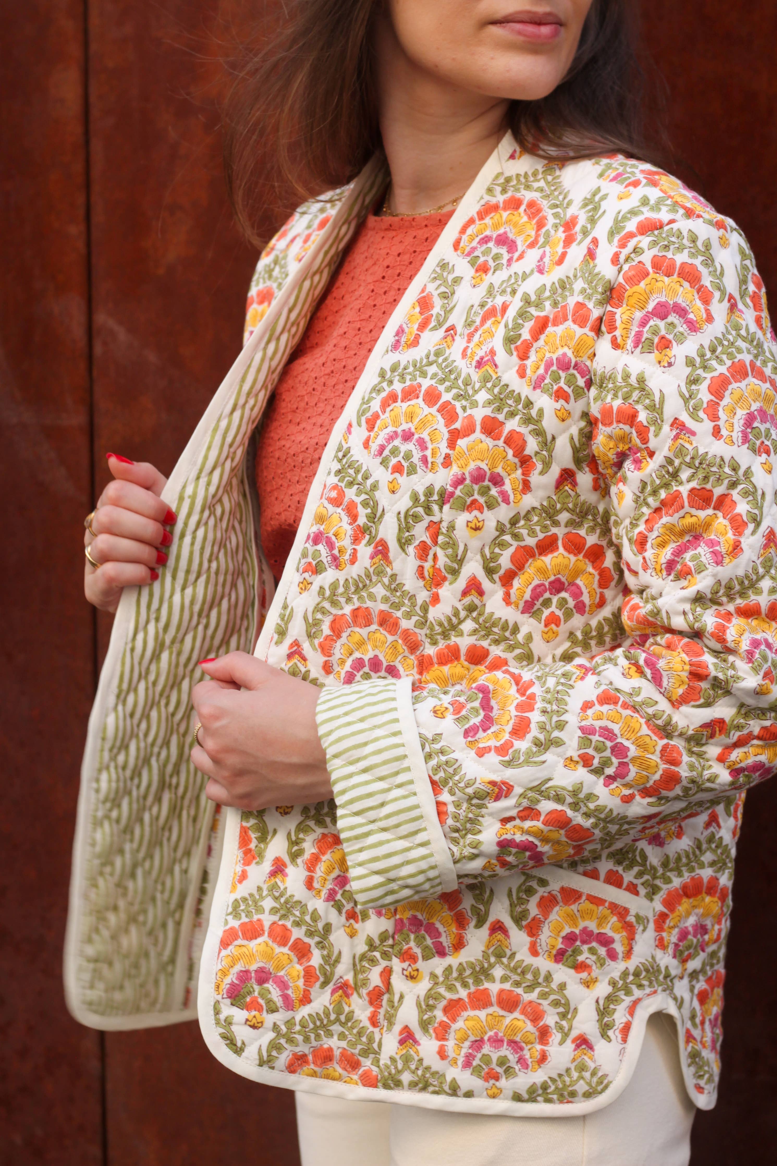 Side view of the floral quilted Siloé Jacket with high collar