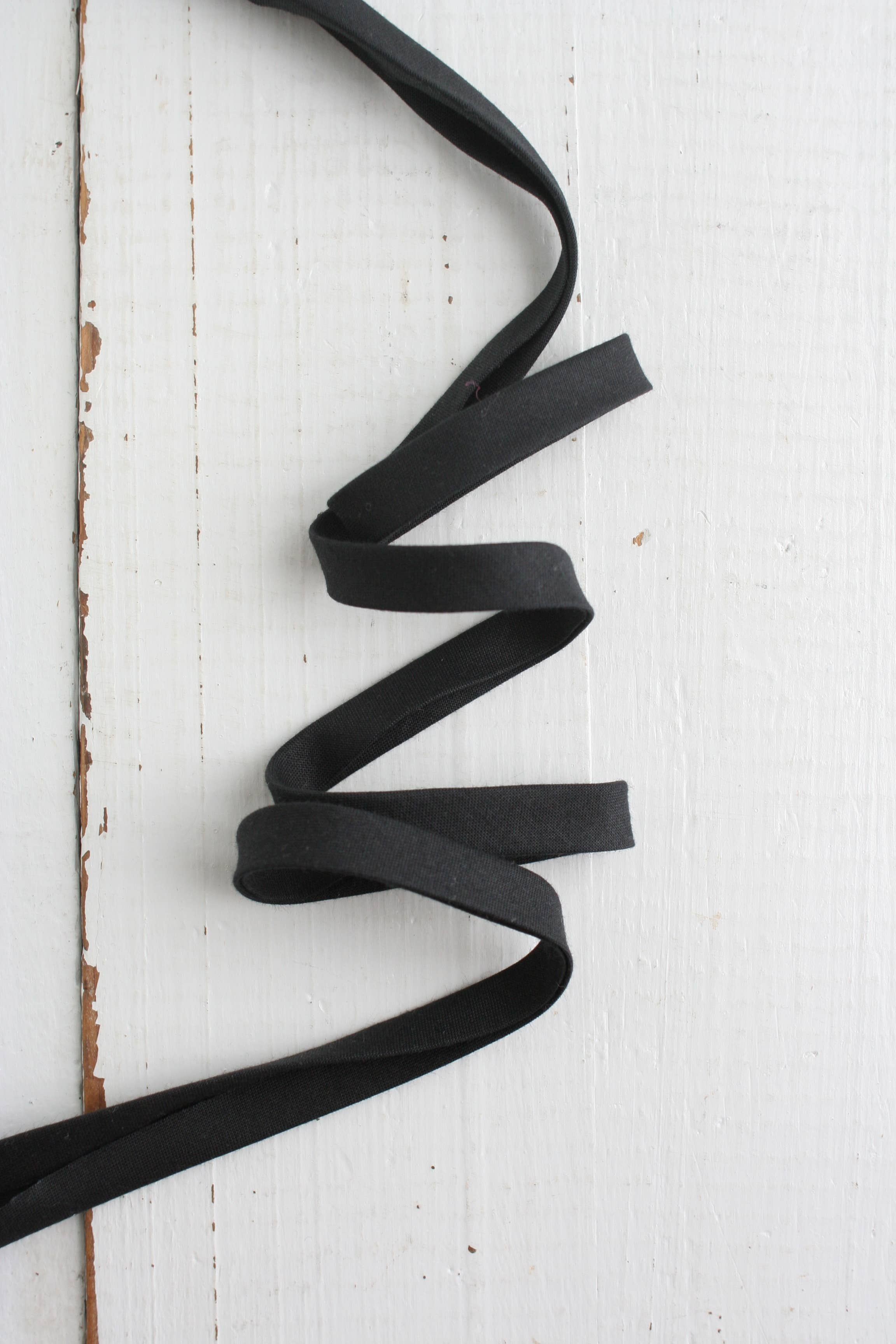 Black Pure Solid 1/2 inch double fold cotton bias binding tape by Bessie Pearl Binding Co