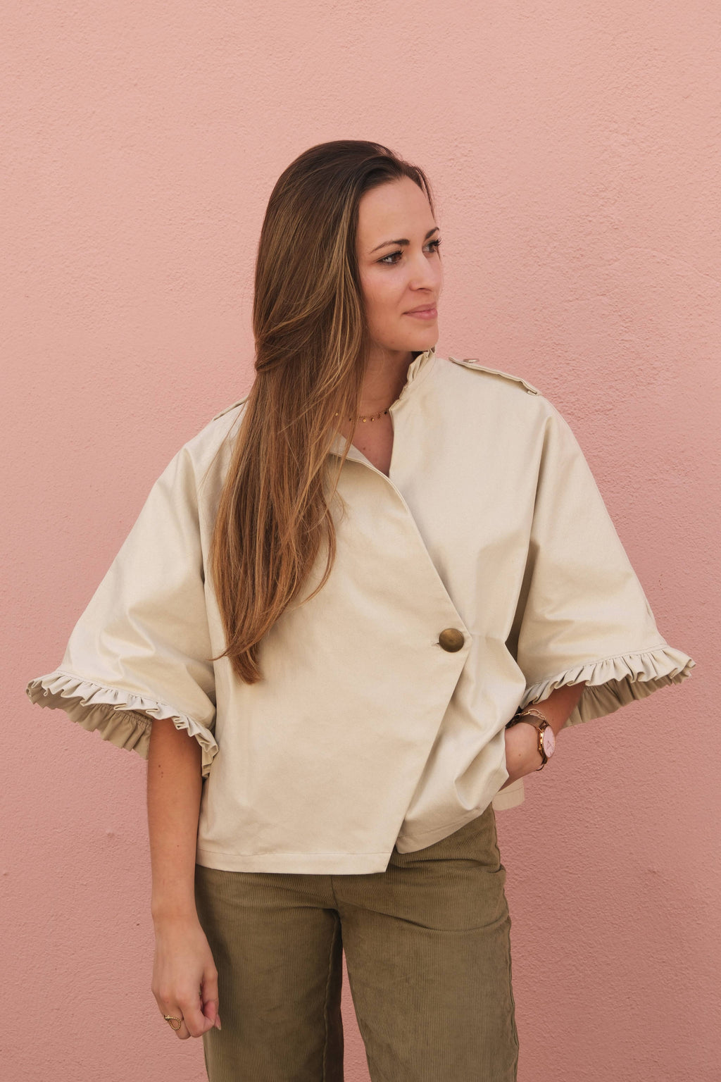 Front view of the Alixia Trench Coat worn open-shouldered with relaxed fit